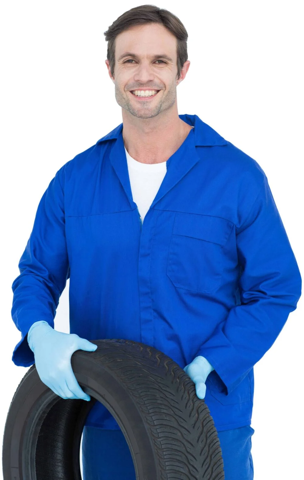 machanic in overalls holding a tyre